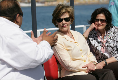 Mrs. Laura Bush and Mrs. Anita McBride, Assistant to the President and Chief of Staff to the First Lady, listen to Mr. Amir Ali, Hurghada Environmental Protection and Conservation Association, as they head out for a coral reefs and ocean conservation tour Saturday, May 17, 2008, in Sharm El Sheikh, Egypt.