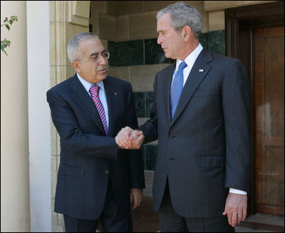 President George W. Bush shakes hands at the conclusion of his meeting with Palestinian Prime Minister Salam Fayyad in Sharm El Sheikh, Egypt, Sunday, May 18, 2008.