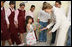 A young girl presents Mrs. Laura Bush with flowers before her departure Sunday, May 18, 2008, following a roundtable discussion with students on Big Read Egypt/U.S. at the Fayrouz Experimental School for Languages at Sharm El Sheikh.