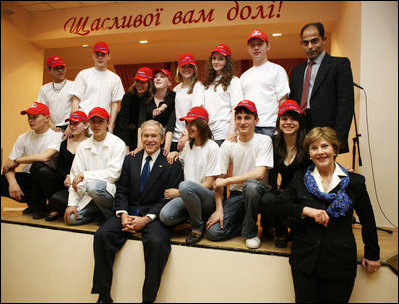 President George W. Bush and Mrs. Laura Bush pose with students from School 57 in Kyiv Tuesday, April 1, 2008, after the Ukrainian teens performed a skit sponsored by PEPFAR, the President's Emergency Plan for AIDS Relief.
