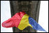 The flag of Romania hangs proudly from the Arcul de Triumf, a 27-meter high arch located in north Bucharest, site of the 2008 NATO Summit.