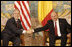 President George W. Bush and President Traian Basescu of Romania, exchange handshakes during their meeting Wednesday, April 2, 2008, in Neptun, Romania.