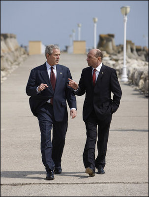 President George W. Bush and President Traian Basescu walk back from their joint press availability Wednesday on the grounds of the presidential retreat at Villas Neptun-Olimp in Neptun, Romania.