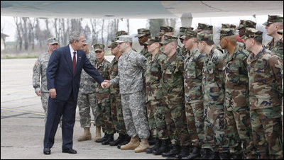 President George W. Bush reaches out to U.S. military personnel Wednesday, April 2, 2008, as he arrived at Mihail Kogaliceanu Airport in Constanta, Romania, for his return flight to Bucharest after meeting with President Traian Basescu at his presidential retreat in Neptun.