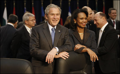 President George W. Bush stands with Secretary of State Condoleezza Rice Thursday, April 3, 2008, during the North Atlantic Council Summit in Bucharest.
