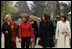 Mrs. Laura Bush walks with the spouses of NATO leaders Thursday, April 3, 2008, at the open-aired Dimitrie Gusti Village Museum in Bucharest. With her are Maria Basescu, right, spouse of Romania's President Traian Basescu, and Alexandra Coman, fiancŽe of Romania's Foreign Minister Adrian Cioroianu.