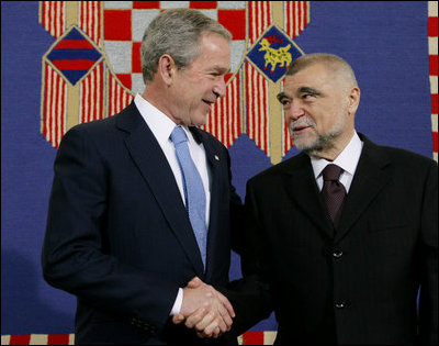 President George W. Bush shakes hands with President Stjepan Mesic of Croatia during arrival ceremonies in honor of the President and Mrs. Bush Friday, April 4, 2008, at the Office of the President in Zagreb.