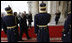 President George W. Bush arrives at the Palace of the Parliament Friday, April 4, 2008, for the second day of meetings at the 2008 NATO Summit in Bucharest. With him are Secretary of State Condoleezza Rice, Secretary of Defense Robert Gates and National Security Advisor Stephen Hadley.