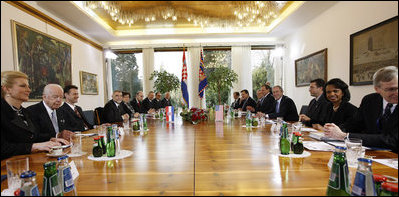 Members of the Croatian and United States delegations pause for photographs at the start of the meeting Friday, April 4, 2008, between President George W. Bush and President Stjepan Mesic in Zagreb.