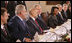 President George W. Bush smiles as he participates in a working lunch with future NATO leaders Saturday, April 5, 2008, in Zagreb. Next to him is President Stjepan Mesic of Croatia.