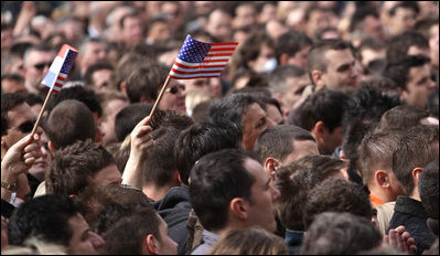 American flags are waved by some in the crowd at Zagreb's St. Mark's Square as President George W. Bush addresses the thousands who turned out to welcome him Saturday April 5, 2008.