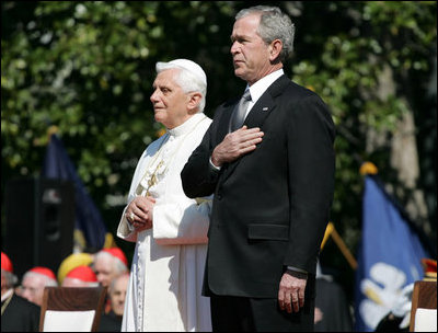 President George W. Bush and Pope Benedict XVI stand together during the playing of the National Anthem at the Pope's welcoming ceremony on the South Lawn of the White House Wednesday, April 16, 2008.