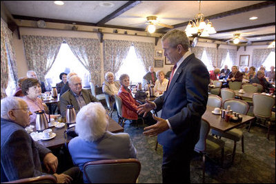 President George W. Bush talks with senior citizens at the Spring House Family Restaurant in Cedar Rapids, Iowa, March 30, 2005.