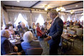 President George W. Bush talks with senior citizens at the Spring House Family Restaurant in Cedar Rapids, Iowa, March 30, 2005.