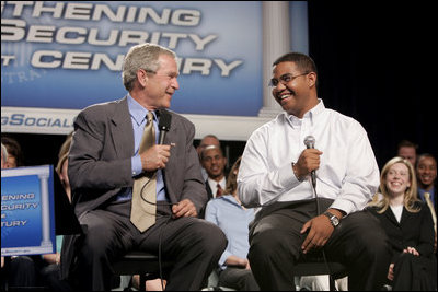 President George W. Bush talks with Yuctan Hodge, 24, during a conversation on Social Security at the James Lee Community Center, Falls Church, Va., Friday, April 29, 2005.