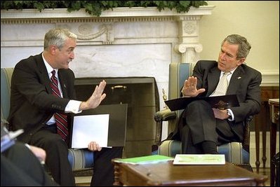 Reviewing a report about the Space Shuttle Columbia tragedy, President George W. Bush meets with NASA Administrator Sean O'Keefe in the Oval Office Monday, Feb. 3, 2003.