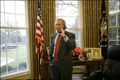 Congratulating NASA on the successful landing of Spirit, the Mars Exploration Rover, President George W. Bush talks with NASA Administrator Sean O.Keefe and the Mission Control Team from the Oval Office Tuesday, Jan. 6, 2004.