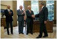 President George W. Bush welcomes Apollo 11 Astronauts Michael Collins, left, Neil Armstrong, center, and Buzz Aldrin to the Oval Office Wednesday, July 21, 2004. The astronauts visited the White House to mark the 35th anniversary of the successful Apollo 11 mission of landing on the moon, walking along its surface and safely returning home.