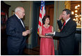 Vice President Dick Cheney swears in NASA Administrator Michael Griffin as his wife, Rebecca Griffin, holds the Bible during a ceremony in the Vice President's Ceremonial Office at the Dwight D. Eisenhower Executive Office Building Tuesday, June 28, 2005. Mr. Griffin is the 11th Administrator of the National Aeronautics and Space Administration.
