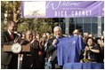 After congratulating NASA staff on the successful landing of the robotic rover Spirit on Mars, Vice President Dick Cheney holds up a shirt bearing the Spirit emblem at the Jet Propulsion Laboratory in Pasedena, Calif., Jan. 14, 2004.