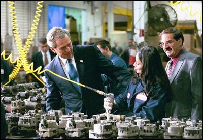 President Bush talks with an employee at U.S.A. Industries in Bay Shore, N.Y., March 11, 2004. “You hear people talking about -- worrying about outsourcing and jobs moving overseas, and one reason why is because they don't have the skills necessary to take the jobs of the 21st century,” said the President in his remarks. “We have an obligation in society to help train the people for the jobs which exist. And so job training has got to focus in smart, practical ways.” 