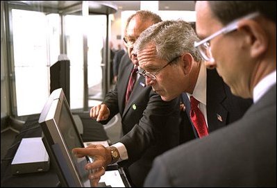 While visiting Argonne National Laboratory in Argonne, Ill., President Bush reviews Homeland Security Technology by lab director Dr. Herman Grunder July 22, 2002. Sponsored by the Dept. of Energy and operated by the University of Chicago, the laboratory is combating terrorism through innovative projects such as detectors for neutrons, biological and chemical agents and developing an emergency response system that coordinates various technologies. 