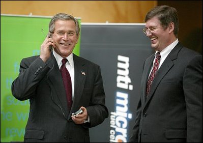 During a demonstration of energy-efficient technologies, President Bush tries out a cell phone powered by hydrogen fuel cell technology at The National Building Museum in Washington, D.C., Feb. 6, 2003. On April 26, 2004, the President announced that the Department of Energy has selected partners through a competitive process to fund new hydrogen research projects totaling $350 million ($575 million with private cost share) to overcome obstacles to a hydrogen economy 