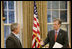 President George W. Bush meets with White House Press Secretary Tony Snow in the Oval Office Sept. 6, 2006.