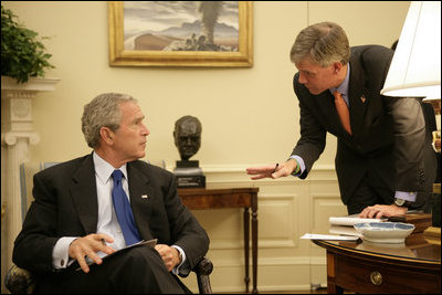 President George W. Bush confers with White House Press Secretary Tony Snow in the Oval Office in this Sept. 14, 2006 White House photo. The 53-year-old former spokesman died Saturday, July 12, 2008. In a statement, the President said: "All of us here at the White House will miss Tony, as will the millions of Americans he inspired with his brave struggle against cancer."