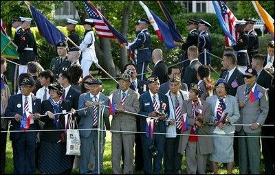 World War II Filipino-American veterans gather on the South Lawn to watch the State Arrival Ceremony for President Gloria Arroyo of the Philippines on the South Lawn Monday, May 19, 2003. 