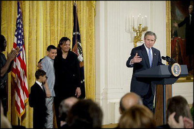 President George W. Bush addresses the audience during a program honoring graduates of welfare-to-work programs in the East Room Tuesday, Jan. 14, 2003. "In the seven years since welfare was reformed, millions of Americans have shared in this experience. Their lives and our country are better off. Today, more than 2 million fewer families are on welfare -- 2 million fewer than in 1996. It's a reduction of 54 percent," said the President. White House photo by Paul Morse.