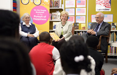 Mrs. Lynne Cheney speaks to students from Ambassador Baptist Christian School, Wednesday, July 11, 2007, at the Anacostia Interim Public Library in Washington, D.C. During Mrs. Cheney's visit the National Endowment for the Humanities announced that all D.C. public libraries will receive this year's We the People Bookshelf, a collection of classic books with themes related to American ideas and ideals. Seated with Mrs. Cheney are Chief Librarian of the D.C. Public Libraries Ginnie Cooper and Chairman of the National Endowment for the Humanities Bruce Cole. White House photo by David Bohrer.