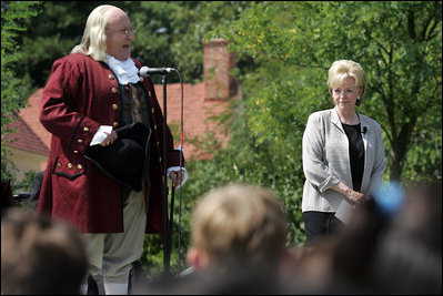 Lynne Cheney looks on as Benjamin Franklin address a group of fourth graders from local Fairfax County public schools during a Constitution Day 2005 celebration at George Washington's Mount Vernon Estate Friday, September 16, 2005. Mrs. Cheney hosted the event which celebrates the anniversary of the signing of the U.S. Constitution 218 years ago.