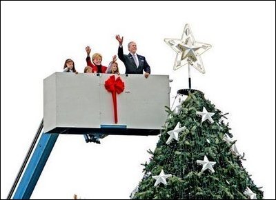  After placing a star on the National Christmas Tree, Lynne Cheney, wife of Vice President Dick Cheney, participates in the annual Pageant of Peace tree-topping tradition with Peter Nostrand, chairman of the Christmas Pageant of Peace program, right, and her three grandchildren (from left): Elizabeth Perry, 7, Grace Perry, 4, Kate Perry, 10, on the Ellipse near the White House Tuesday, Nov. 23, 2004. The 81st lighting of the famous tree takes place Dec. 2, 2004.