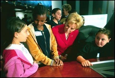 Lynne Cheney talks with 5th grade students Ashley Giorgio, left, and Anasha Segers, center, while they wait to take a seat on the Supreme Court Bench at the the National Constitution Center in Philadelphia Wednesday, Sept. 17, 2003.