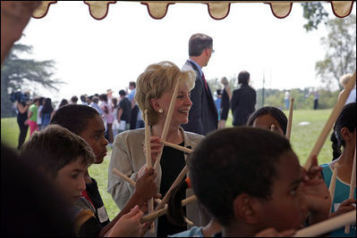 Lynne Cheney participates in a drumming activity with a group of fourth graders from local Fairfax County public schools during a Constitution Day 2005 celebration at George Washington's Mount Vernon Estate Friday, September 16, 2005. The event celebrates the anniversary of the signing of the U.S. Constitution 218 years ago. 