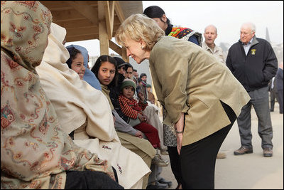 Vice President Dick Cheney and Mrs. Lynne Cheney greet Pakistani patients awaiting care at the 212th M.A.S.H. Unit near the earthquake's epicenter Tuesday, Dec. 20, 2005.