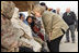 Vice President Dick Cheney and Mrs. Lynne Cheney greet Pakistani patients awaiting care at the 212th M.A.S.H. Unit near the earthquake's epicenter Tuesday, Dec. 20, 2005.