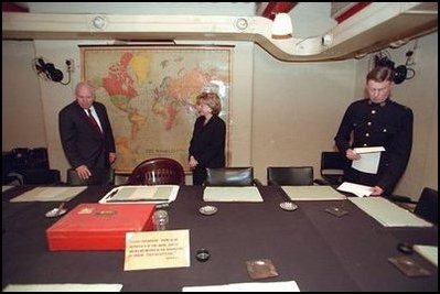 Vice President Dick Cheney and Lynne Cheney tour Winston Churchill's Cabinet War Room in London March 11, 2002. Sitting at the center chair in this underground bunker, Prime Minister Churchill met with his advisors and commanded England's forces. Shortly after Pearl Harbor, the Prime Minister took a risky journey to meet with President Roosevelt in Washington, D.C., and address Congress Dec. 26, 1941. The two leaders worked closely throughout the war, often in secret, to coordinate Allied Forces.