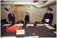 Vice President Dick Cheney and Lynne Cheney tour Winston Churchill's Cabinet War Room in London March 11, 2002. Sitting at the center chair in this underground bunker, Prime Minister Churchill met with his advisors and commanded England's forces. Shortly after Pearl Harbor, the Prime Minister took a risky journey to meet with President Roosevelt in Washington, D.C., and address Congress Dec. 26, 1941. The two leaders worked closely throughout the war, often in secret, to coordinate Allied Forces.