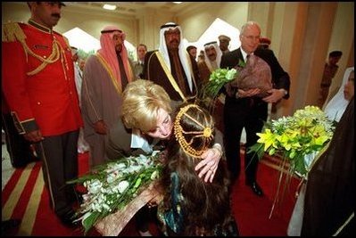 Two children greet Vice Present Dick Cheney and Mrs. Cheney with bouquets of flowers upon their arrival at Dasman Palace in Kuwait City, Kuwait, March 18. 