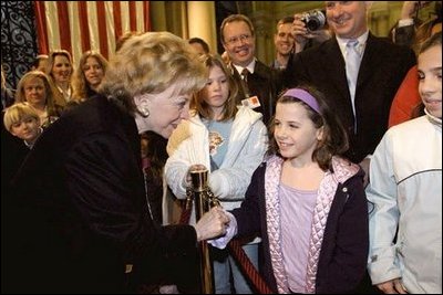 Lynne Cheney greets a young girl while visiting the U.S. Embassy in Rome Jan. 27, 2004. The visit concludes a five-day trip to Switzerland and Italy by Vice President Dick Cheney and Mrs. Cheney. White House photo by David Bohrer. 