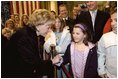 Lynne Cheney greets a young girl while visiting the U.S. Embassy in Rome Jan. 27, 2004. The visit concludes a five-day trip to Switzerland and Italy by Vice President Dick Cheney and Mrs. Cheney. White House photo by David Bohrer. 
