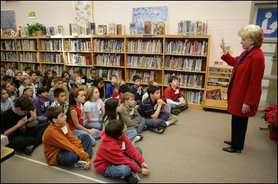Mrs. Cheney holds up her finger as she describes to students at W.W. Burrows Elementary School in Quantico the procedure for casting votes in the upcoming parliamentary elections in Iraq and its importance. Mrs. Cheney spoke to the kids Tuesday, Dec. 13, 2005, on the U.S. Marine Corps base.