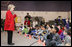 Students at Fort Belvoir Elementary School fill the gymnasium Tuesday, Dec. 13, 2005, for a visit by Mrs. Lynne Cheney. Mrs. Cheney spoke with the kids about the importance of the upcoming Iraqi elections and likened the parliamentary procedure to that of America's in its own early struggle for democracy.