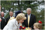 Mrs. Lynne Cheney receives a bouquet of flowers Friday, May 4, 2007, during a tour of Jamestown Settlement in Williamsburg, Virginia. White House photo by David Bohrer
