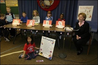 Lynne Cheney appears as the special guest on WKID, a live televised morning news program for and by Ashurst Elementary School students, on Marine Corps Base, Quantico, Va., Oct. 23, 2003. After singing the Star-Spangled Banner, Mrs. Cheney discussed her two children's books "America: A Patriotic Primer" and "A is for Abigail: An Almanac of Amazing American Women" during the segment titled The Reading Corner. Pictured are the student anchors for the program who are, from left, Micheal Finney, Alexis Till, Breena McCarthy and Amber Warford.