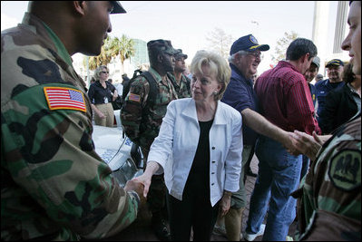Mrs. Cheney shakes hands with police and military EMS personnel during a recent tour to the flood ravaged areas of New Orleans, Louisiana Thursday, September 8, 2005, to survey damage and relief efforts in the wake of Hurricane Katrina.