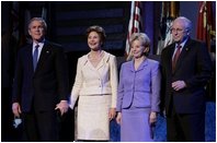 President George W. Bush stands with Laura Bush, Lynne Cheney and Vice President Dick Cheney during the pre-inaugural event “Saluting Those Who Serve” at the MCI Center in Washington, D.C., Tuesday Jan. 18, 2005.