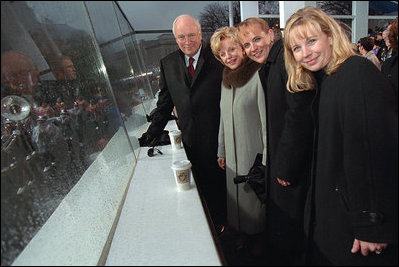 Following the swearing-in ceremony at the U.S. Capitol, Vice President Dick Cheney watches the Presidential Inaugural Parade with his wife, Lynne, left, and daughters Mary, center, and Liz January 20, 2001.
